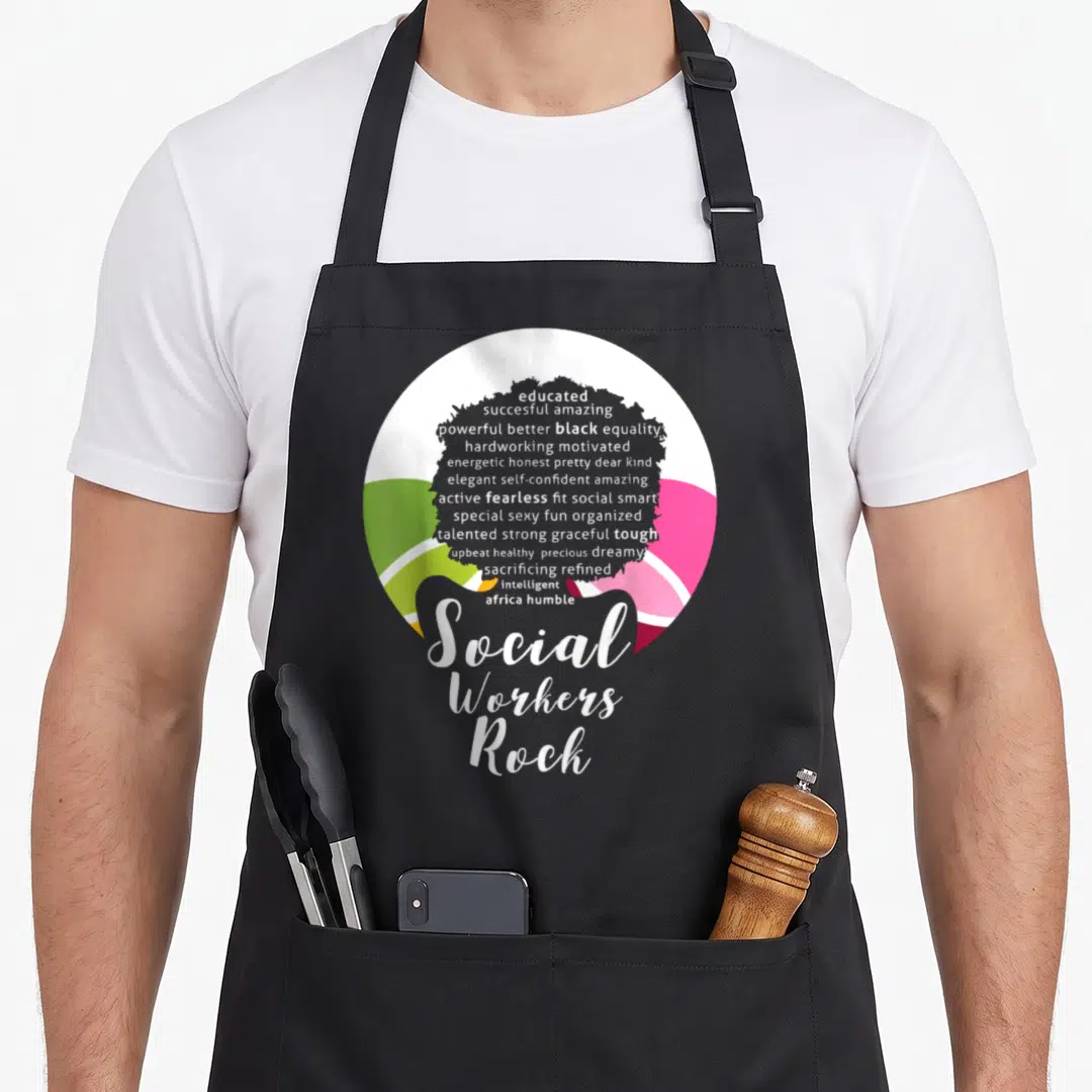 Queen magic apron - Grey female silhouette filled with white adjectives over colored circle with Social Workers Rock — shown on a black cotton canvas apron against a white background