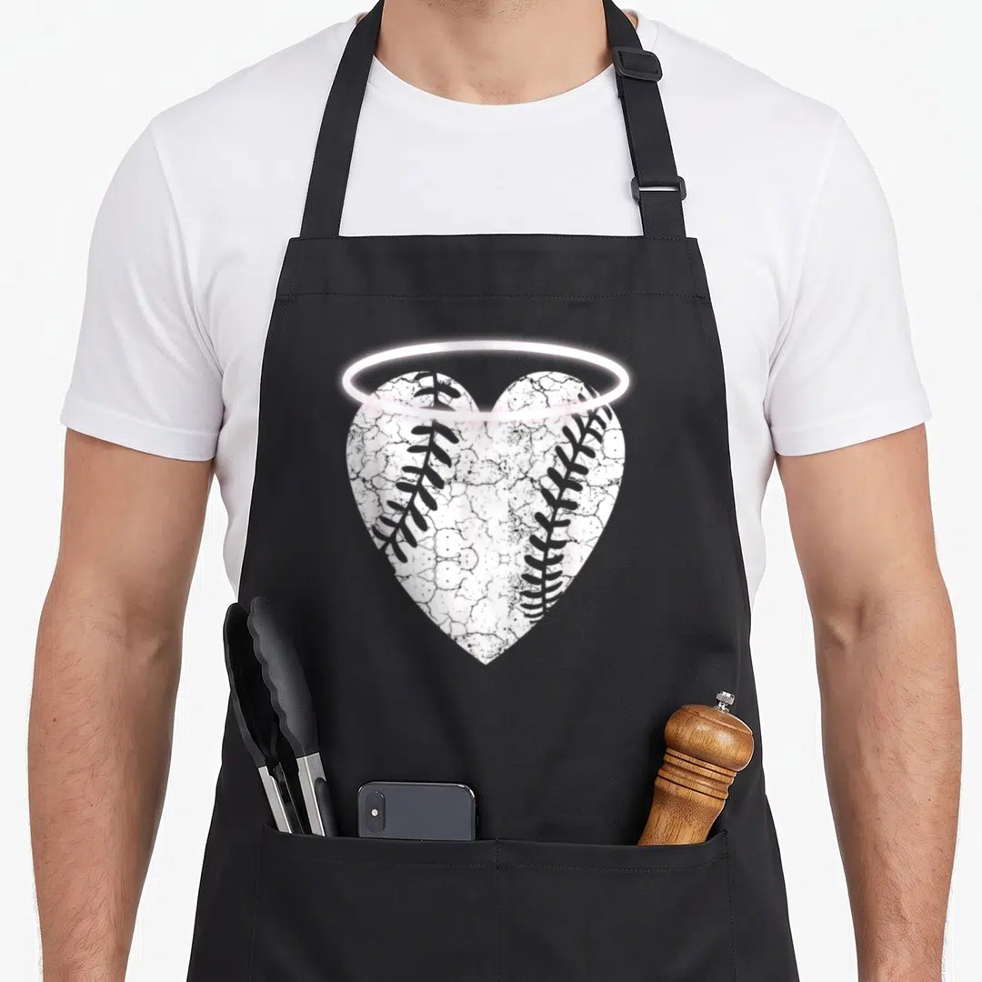 Baseball halo angels in aprons - White heart with grey baseball stitching and glowing pink halo graphic — shown on a black cotton canvas apron against a white background