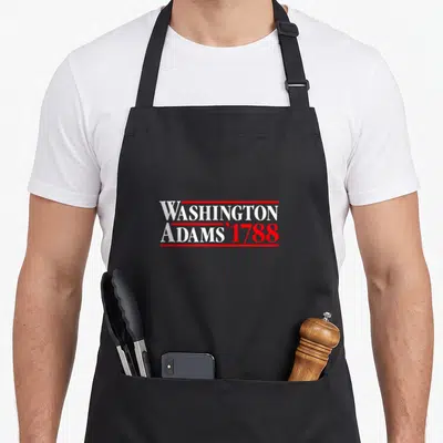 George georgian apron - Red and white stacked text reading WASHINGTON ADAMS '1788 framed by horizontal bars — shown on a black cotton canvas apron against a white background