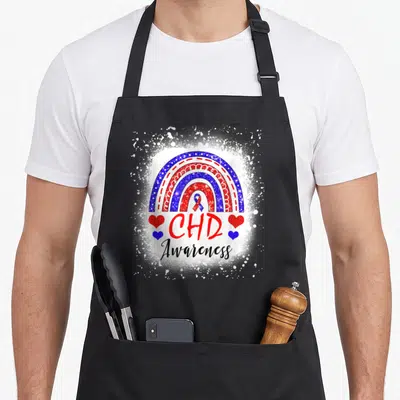 Chd rainbow apron - Glittery red white blue rainbow with CHD Awareness text and four hearts — shown on a black cotton canvas apron against a white background