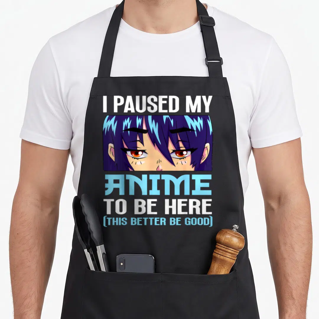 Better anime apron - Anime character eyes with purple hair and text I paused my anime to be here — shown on a black cotton canvas apron against a white background