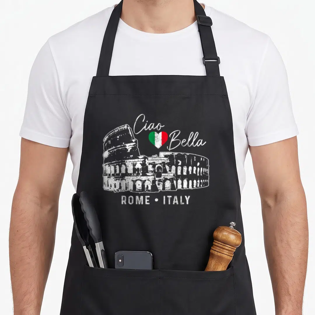 Roma italian flag apron - Distressed Colosseum with Ciao Bella text and tricolor heart — shown on a black cotton canvas apron against a white background