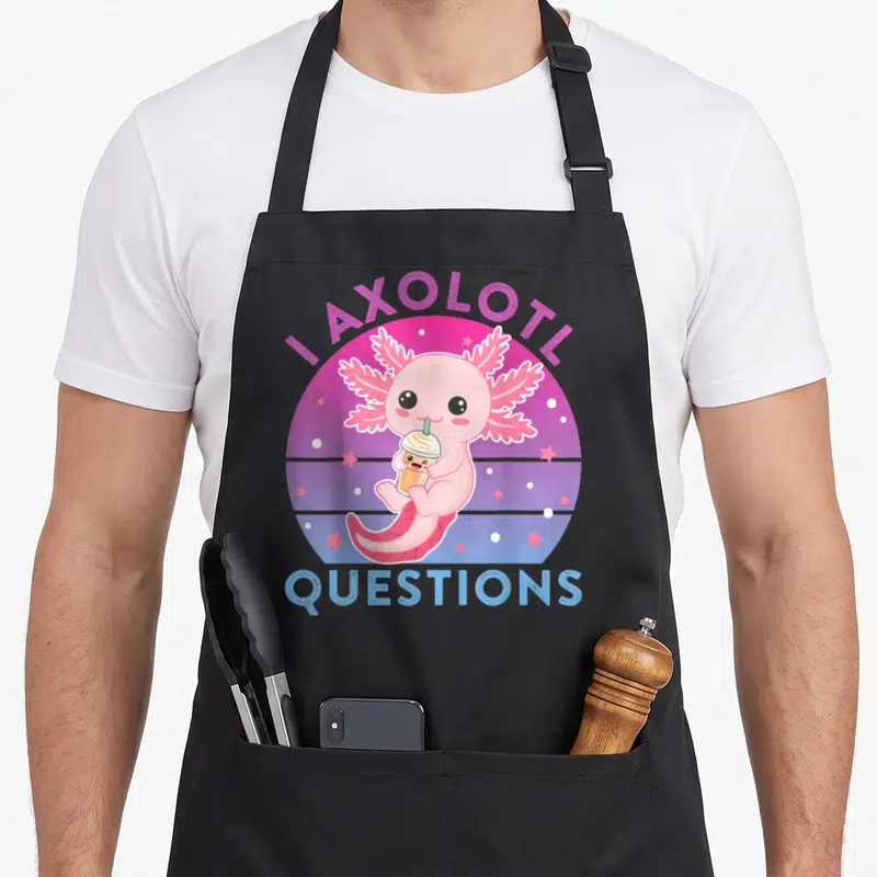 Funny ask axolotl questions apron - Pink cartoon axolotl holding a tan drink inside a purple and blue gradient circle — shown on a black cotton canvas apron against a white background