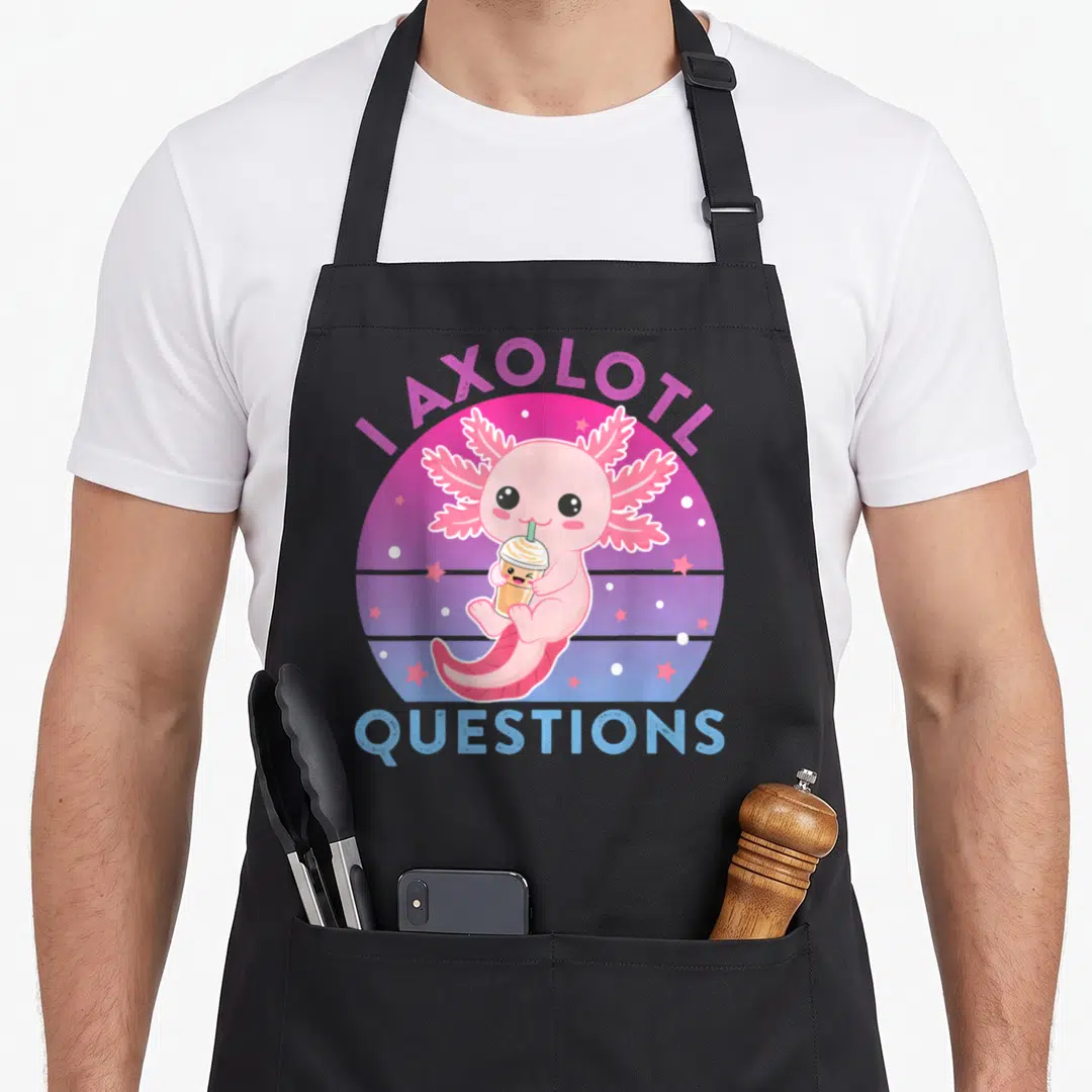 Funny ask axolotl questions apron - Pink cartoon axolotl holding a tan drink inside a purple and blue gradient circle — shown on a black cotton canvas apron against a white background