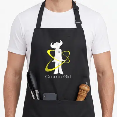 Cosmic buffalo apron - White girl silhouette with horns and yellow rings above Cosmic Girl text — shown on a black cotton canvas apron against a white background