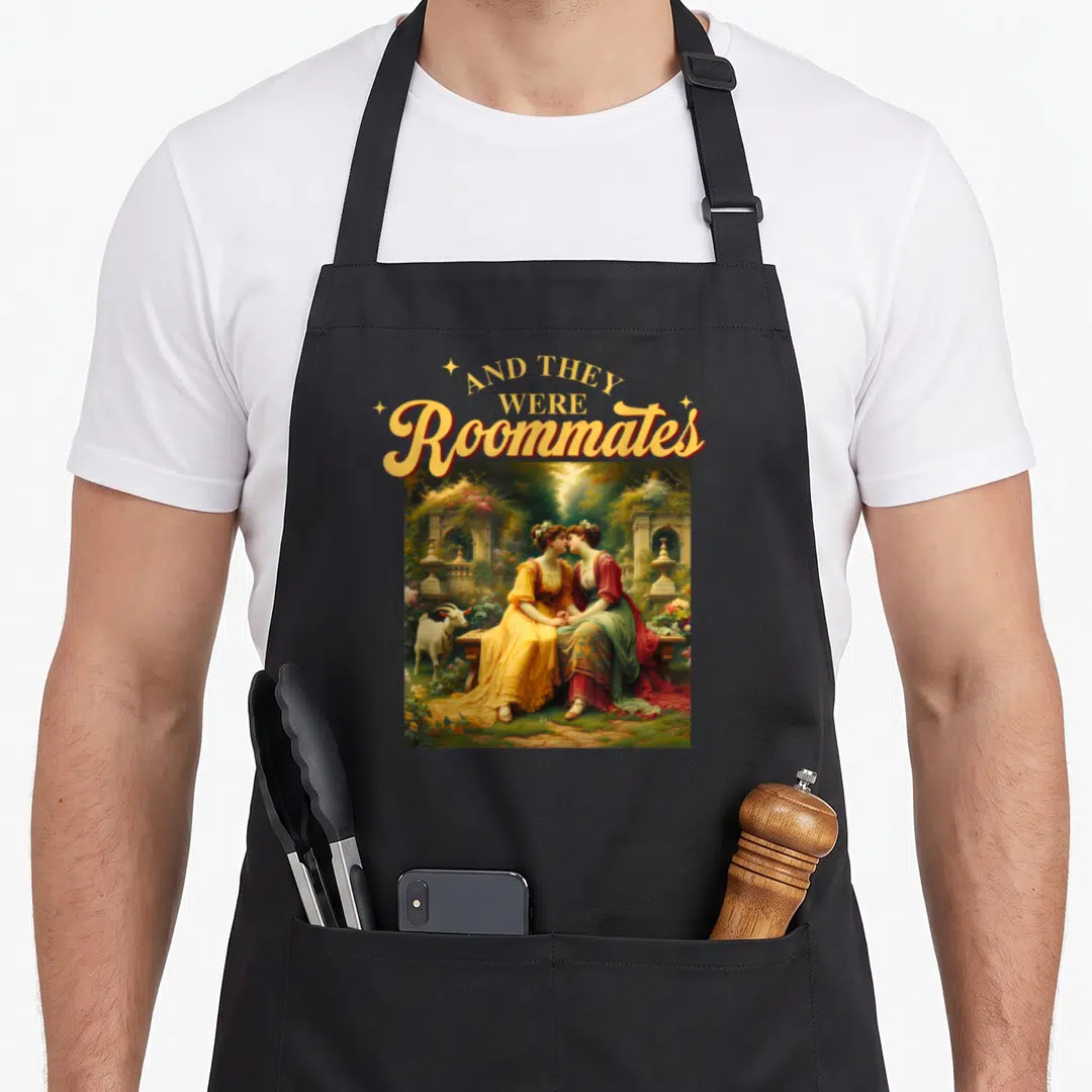 Lgbtq meme apron - Arched text above painting of two women on a bench with a goat in a garden — shown on a black cotton canvas apron against a white background