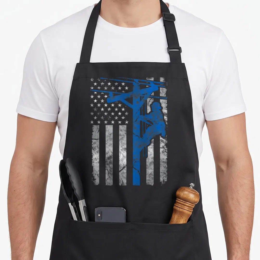 Thin patriotic aprons - Blue lineman silhouette on distressed white and blue American flag pattern — shown on a black cotton canvas apron against a white background