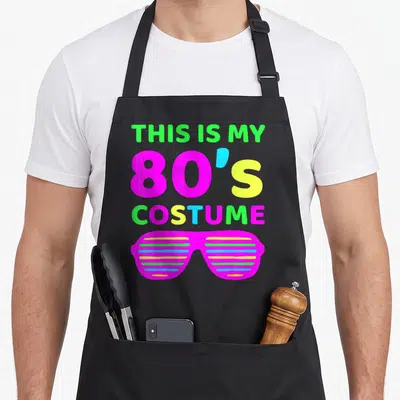 Outfit eighty 80s apron - Stacked text THIS IS MY 80'S COSTUME above magenta shutter shades — shown on a black cotton canvas apron against a white background