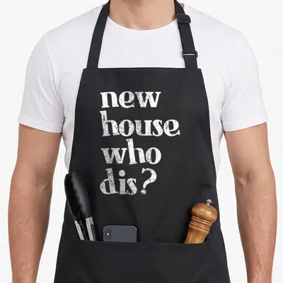 Homeowner novelty apron - White stacked text reading new house who dis in distressed font — shown on a black cotton canvas apron against a white background