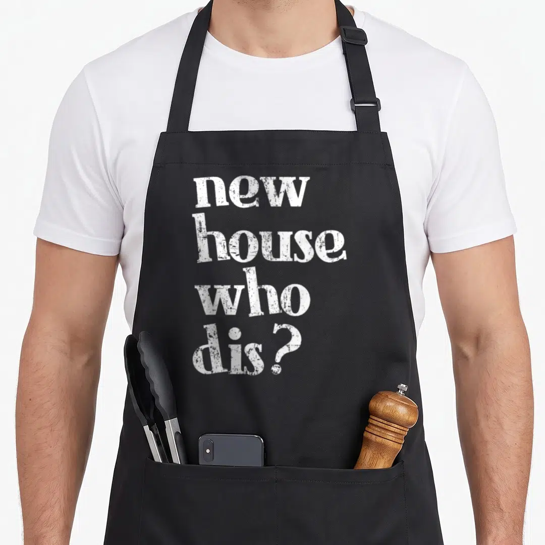 Homeowner novelty apron - White stacked text reading new house who dis in distressed font — shown on a black cotton canvas apron against a white background