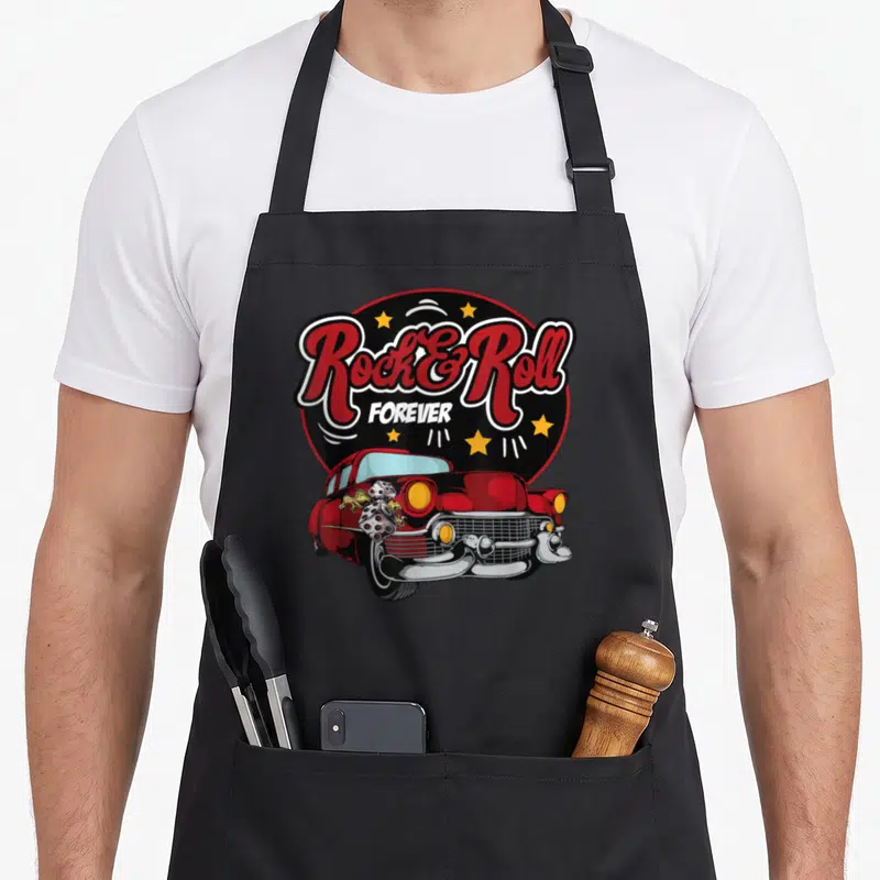Wop rockabilly apron - Red vintage car with dice flames under Rock and Roll Forever text and yellow stars — shown on a black cotton canvas apron against a white background