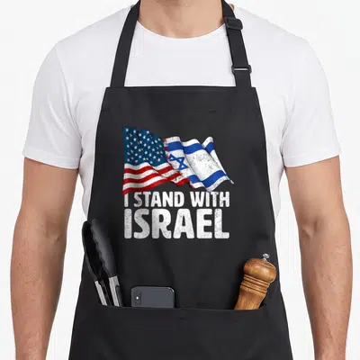 Stand american flag apron - Merged US and Israeli flags with I STAND WITH ISRAEL text in distressed red white blue — shown on a black cotton canvas apron against a white background