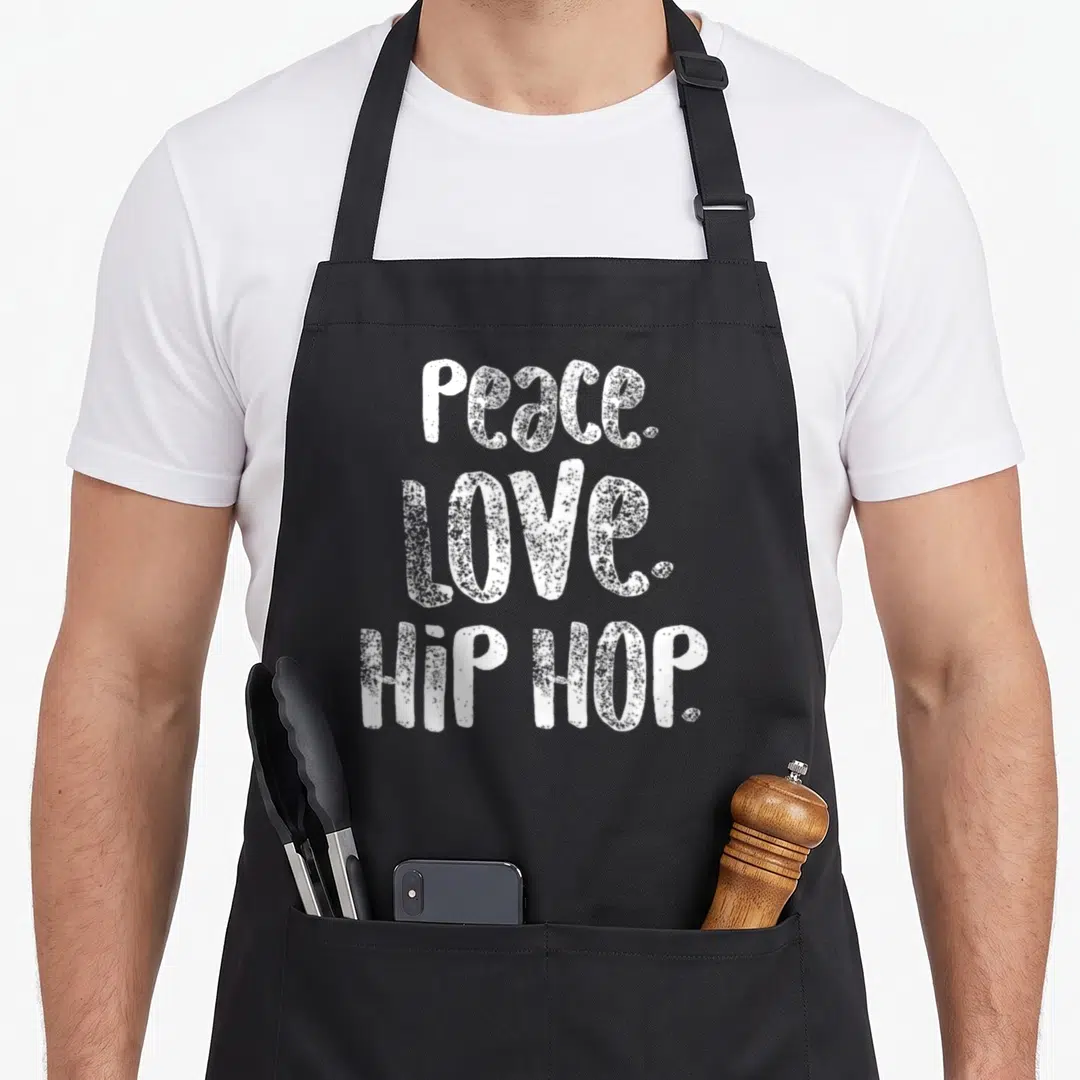 Peace hip aprons - White stacked text reading PEACE. LOVE. HIP HOP. on grey background — shown on a black cotton canvas apron against a white background