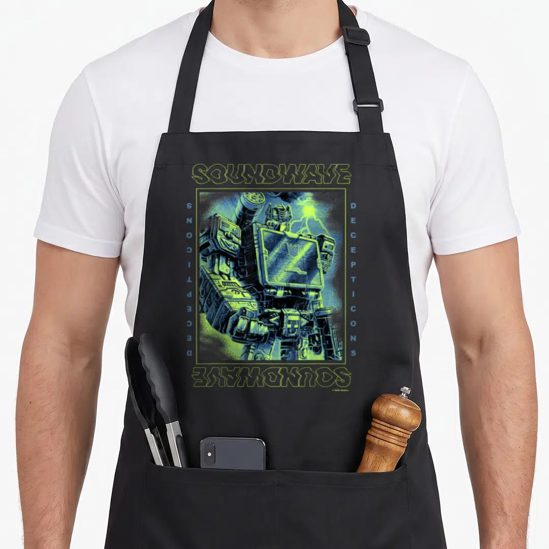Portrait transformer apron - Retro Soundwave portrait in green and blue frame with vertical Decepticons text borders — shown on a black cotton canvas apron against a white background