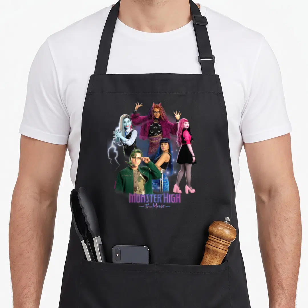 Funny monster high apron - Four movie characters clustered with lightning bolt and MONSTER HIGH The Movie text — shown on a black cotton canvas apron against a white background