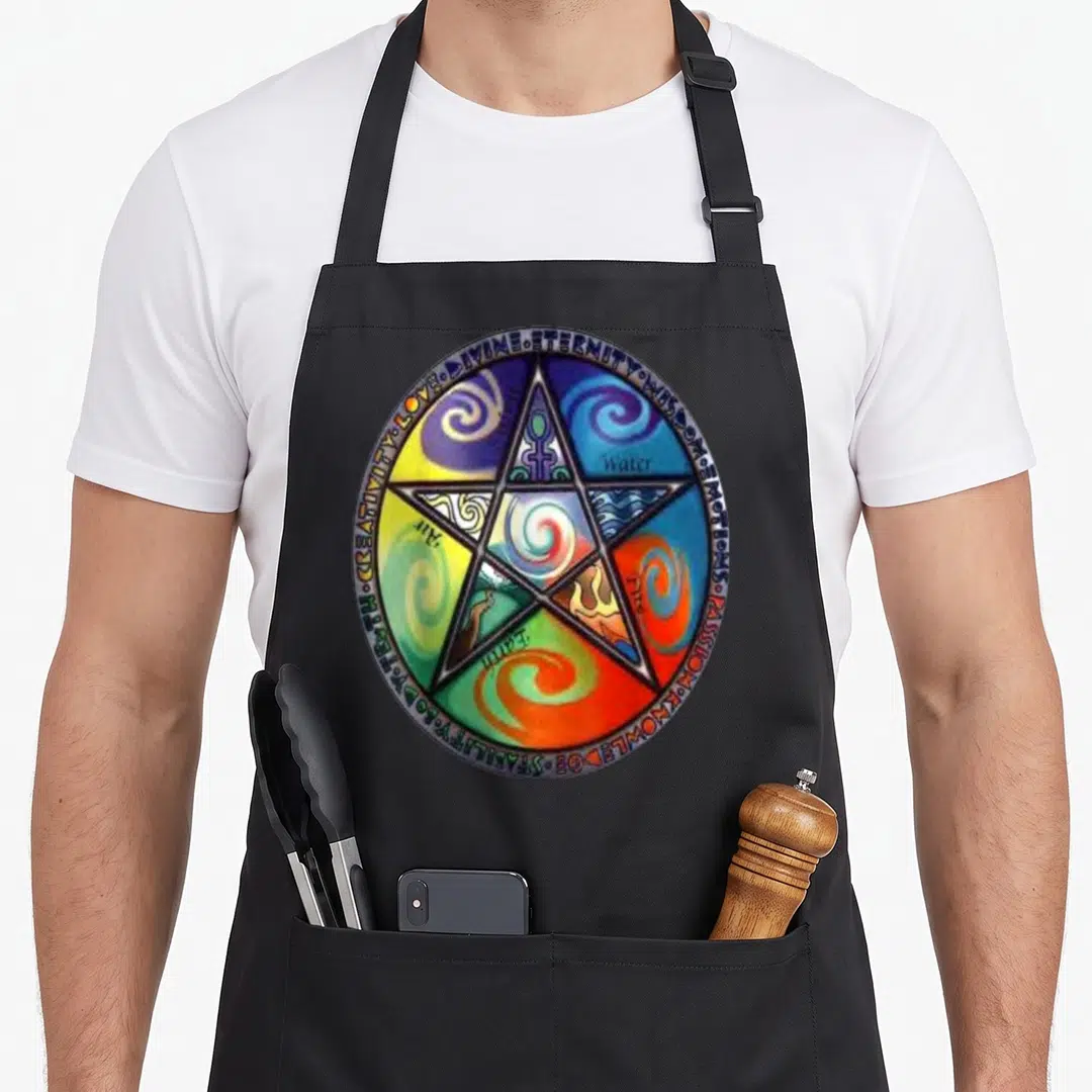 Wiccan magic apron - Pentagram with Spirit Water Fire Earth Air labels and virtue text border in colorful swirls — shown on a black cotton canvas apron against a white background