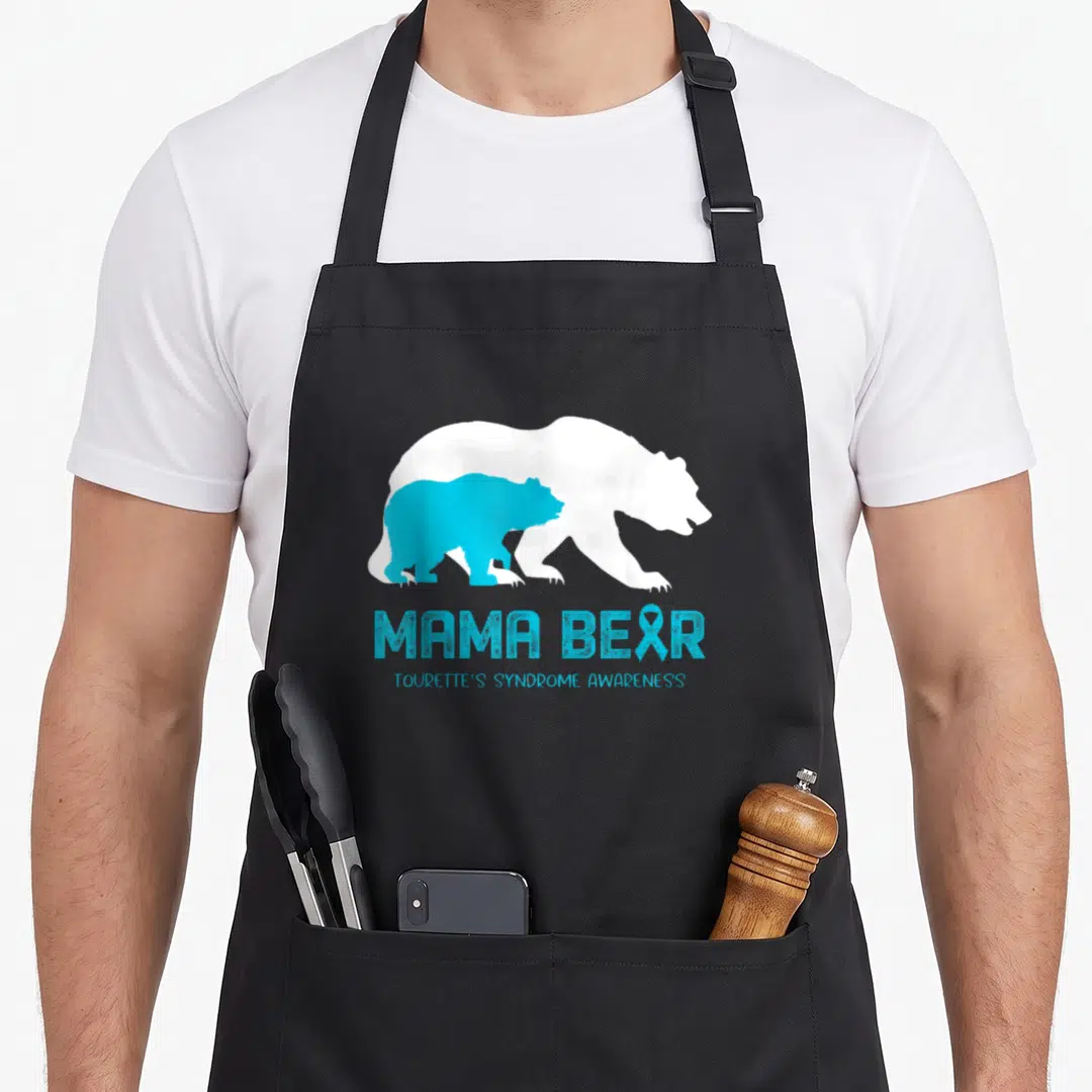 Tourette mama bear apron - Cyan bear inside white bear silhouette with MAMA BEAR TOURETTE'S SYNDROME AWARENESS text — shown on a black cotton canvas apron against a white background