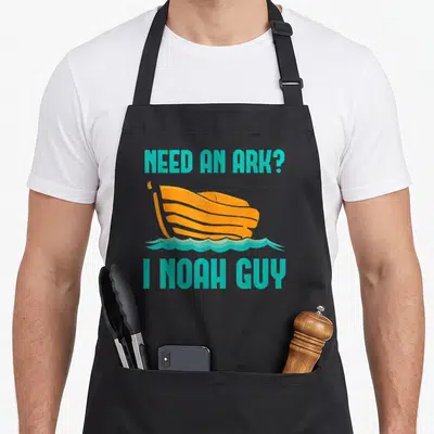 Ark prayer apron - Teal text Need An Ark I Noah Guy above orange ark on teal waves — shown on a black cotton canvas apron against a white background