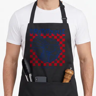 Paris remy ratatouille apron - Blue line-art rat in white circle over red white checkerboard with LA RATATOUILLE — shown on a black cotton canvas apron against a white background