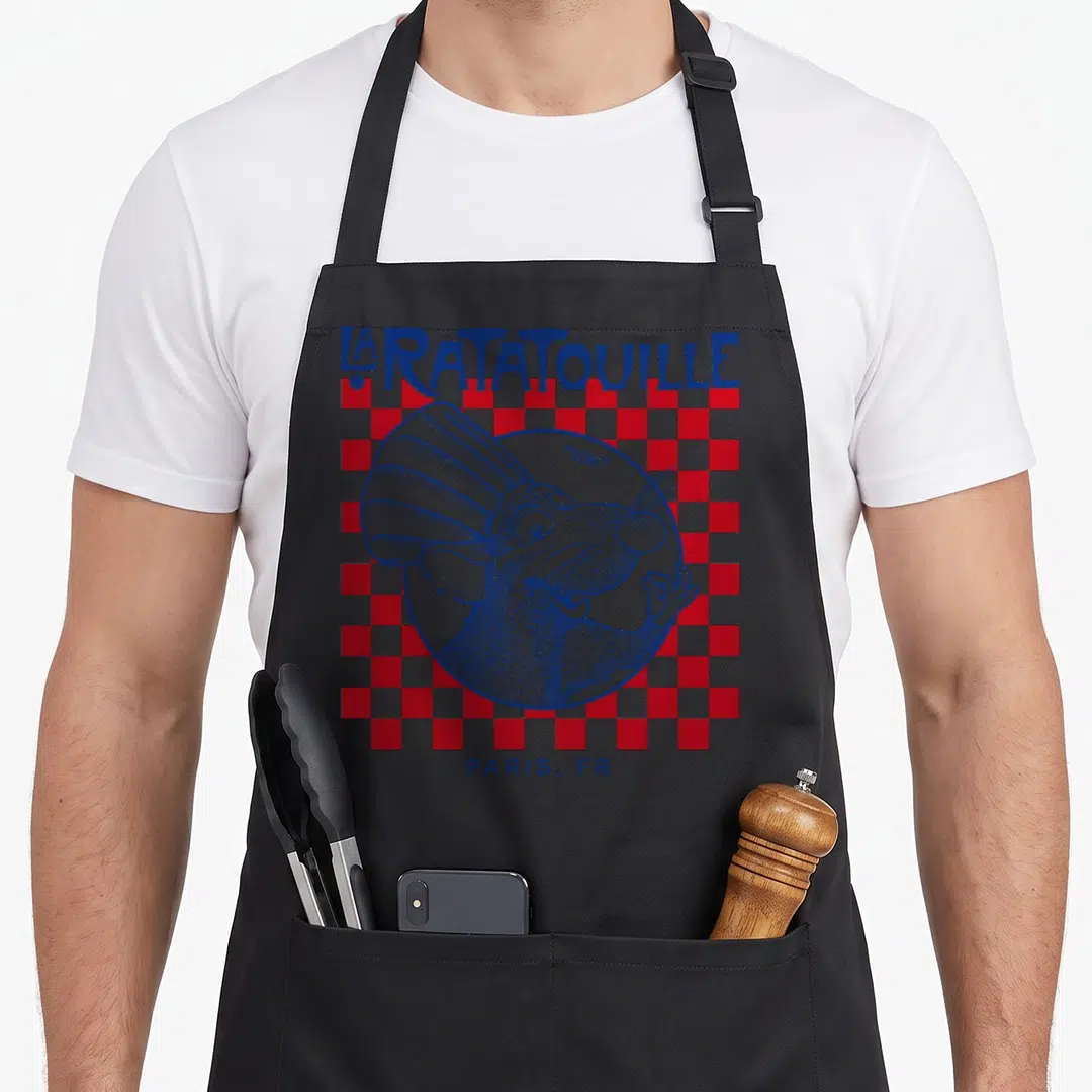 Paris remy ratatouille apron - Blue line-art rat in white circle over red white checkerboard with LA RATATOUILLE — shown on a black cotton canvas apron against a white background