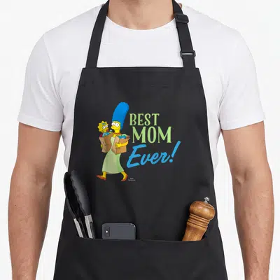 Marge simpson apron - Marge Simpson carrying Maggie in a bag next to BEST MOM Ever text in green and blue — shown on a black cotton canvas apron against a white background