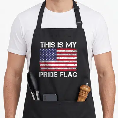 Pride 4th of july apron - Distressed USA flag with THIS IS MY PRIDE FLAG text in white red and blue — shown on a black cotton canvas apron against a white background