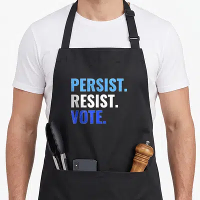 Persist rally apron - Stacked blue and white text reading PERSIST. RESIST. VOTE. on black fabric — shown on a black cotton canvas apron against a white background