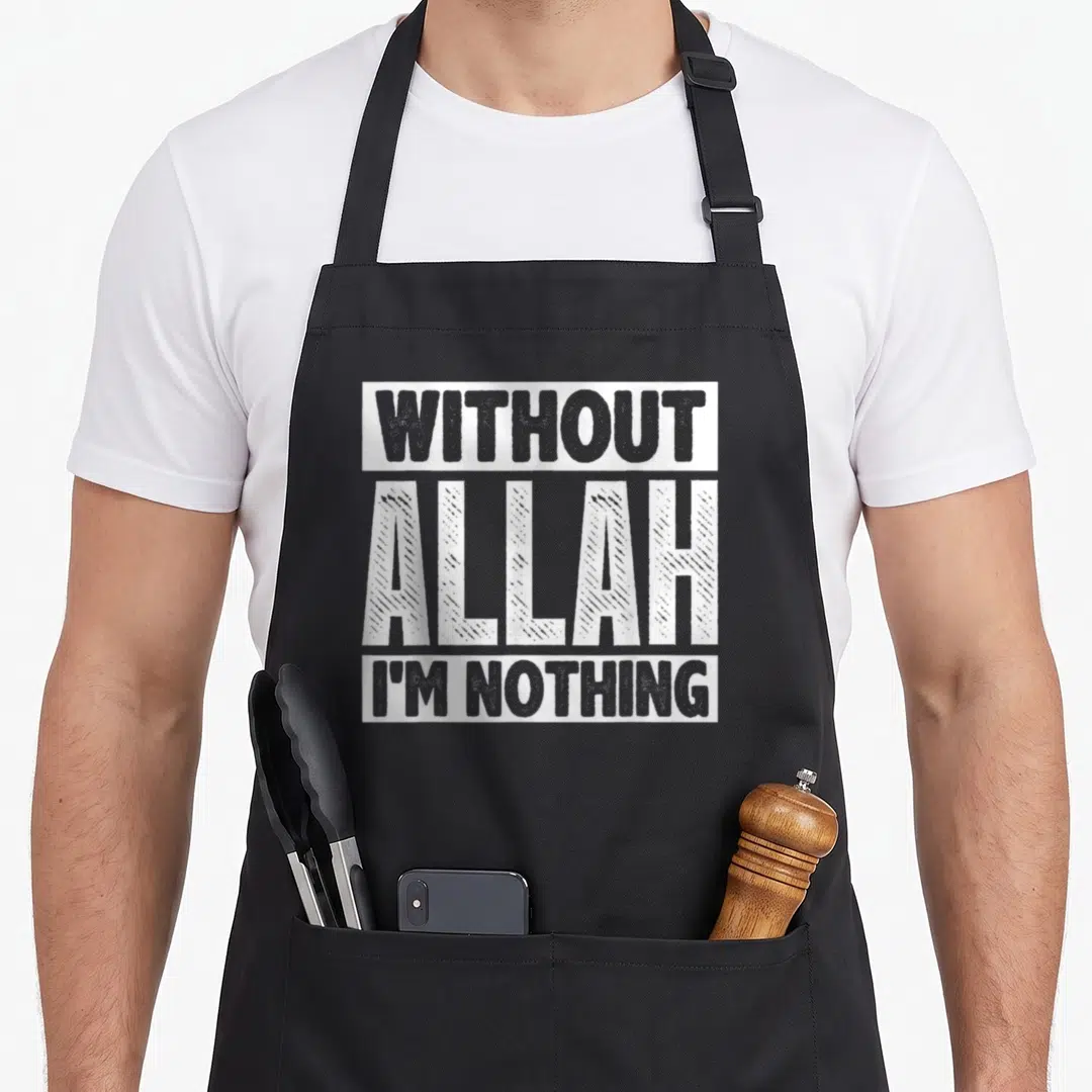 Allah islam ramadan apron - White stacked text WITHOUT ALLAH I'M NOTHING with striped central word on black fabric — shown on a black cotton canvas apron against a white background