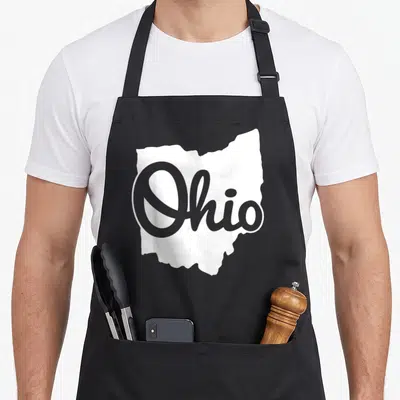 Script ohio apron - White Ohio state silhouette with grey script text overlay — shown on a black cotton canvas apron against a white background