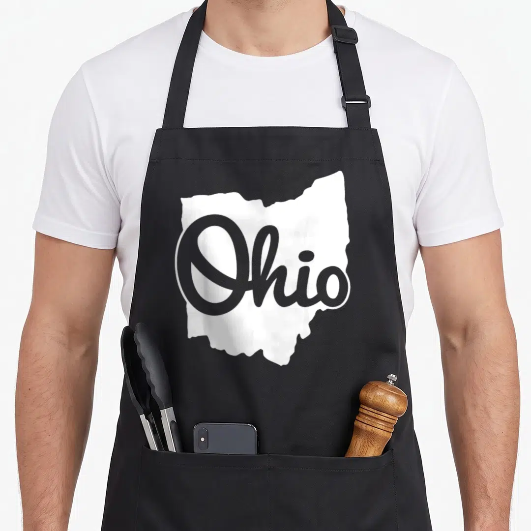 Script ohio apron - White Ohio state silhouette with grey script text overlay — shown on a black cotton canvas apron against a white background