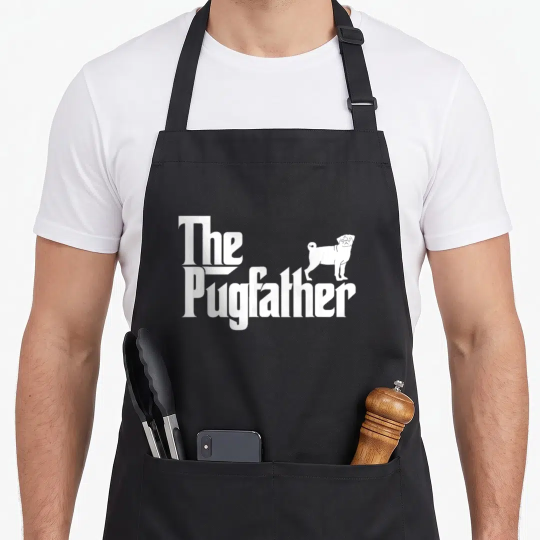Pug owner father apron - White The Pugfather text with a standing pug illustration in minimalist style — shown on a black cotton canvas apron against a white background