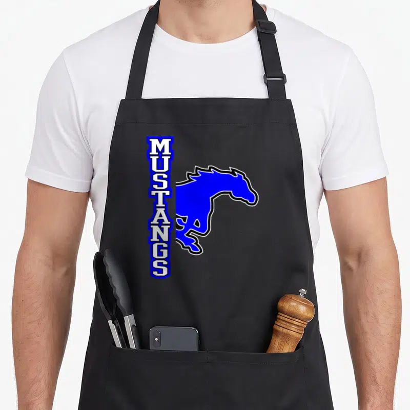 School mustang apron - Vertical MUSTANGS text beside blue horse silhouette with black outline — shown on a black cotton canvas apron against a white background
