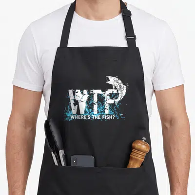 Fishermen fish apron - Distressed WTF text with blue splashes and jumping fish illustration — shown on a black cotton canvas apron against a white background