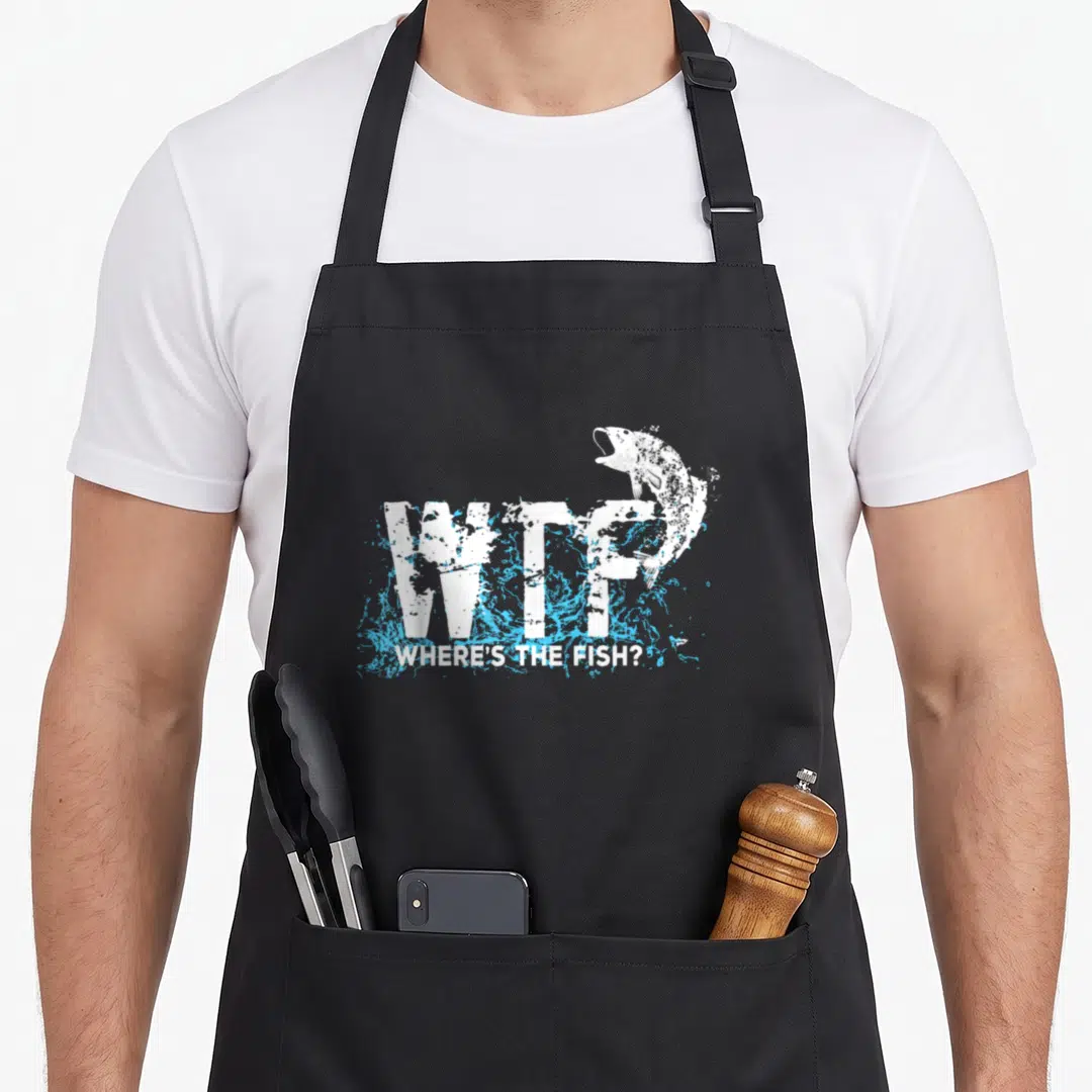 Fishermen fish apron - Distressed WTF text with blue splashes and jumping fish illustration — shown on a black cotton canvas apron against a white background