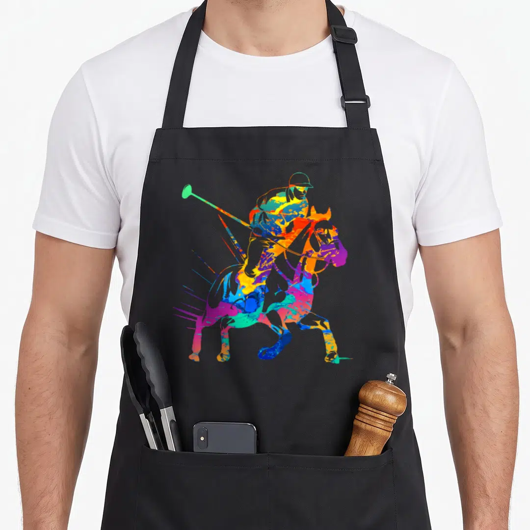 Player horse apron - Tie-dye silhouette of polo player on horse holding mallet in blue yellow red green purple — shown on a black cotton canvas apron against a white background