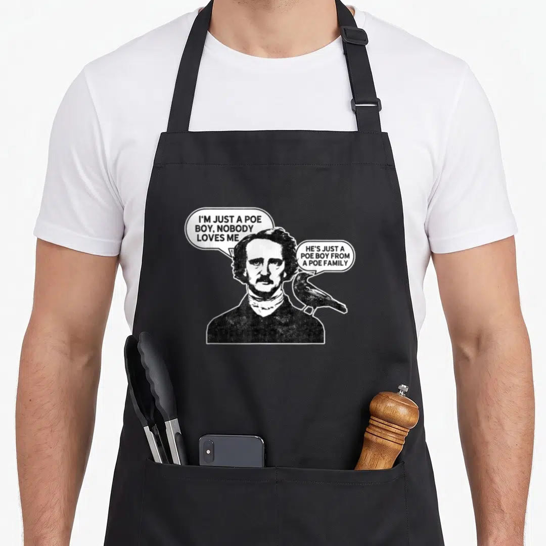 Poe ravens aprons - Edgar Allan Poe portrait with raven and speech bubbles reading I'm just a Poe boy nobody loves me — shown on a black cotton canvas apron against a white background