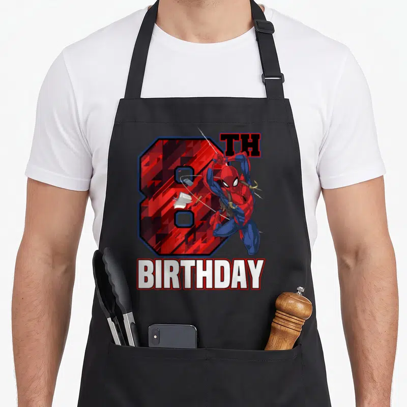 Swing 8th birthday apron - Spider-Man figure overlapping a red number 8 with BIRTHDAY text below — shown on a black cotton canvas apron against a white background