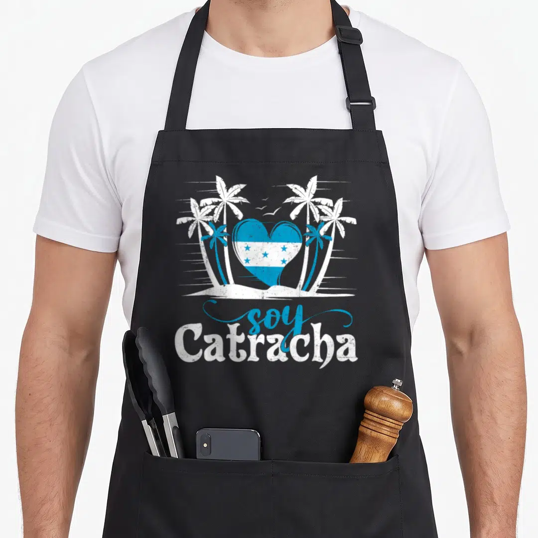 Soy honduran girl apron - Blue heart with Honduras flag and white palm trees with soy Catracha text — shown on a black cotton canvas apron against a white background
