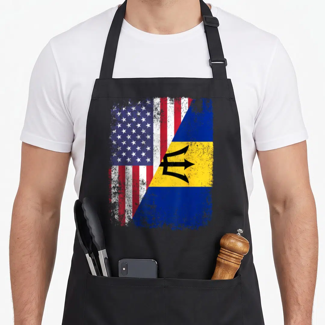 Barbado american flag apron - Two flags merged diagonally with distressed texture showing stars stripes and trident — shown on a black cotton canvas apron against a white background