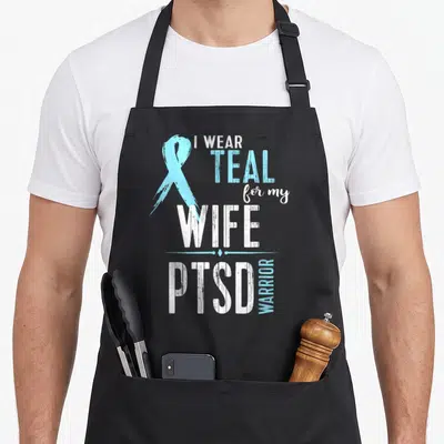 Ptsd wife apron - Teal awareness ribbon and stacked white and teal text reading I Wear Teal for My Wife PTSD Warrior — shown on a black cotton canvas apron against a white background