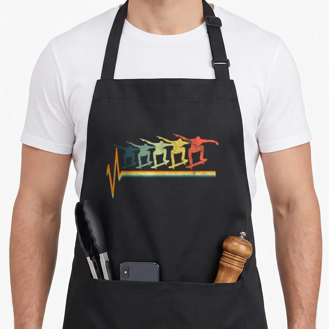 Skater skateboard apron - Five colored skater silhouettes in a row above a retro heartbeat pulse line — shown on a black cotton canvas apron against a white background