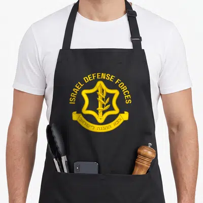 Israel military apron - Yellow IDF emblem with sword, olive branch, and bilingual text on grey background — shown on a black cotton canvas apron against a white background