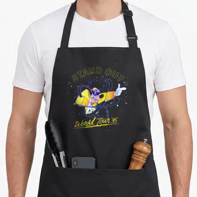 Powerline novelty apron - Goofy wearing sunglasses with STAND OUT and World Tour '95 text in yellow and blue — shown on a black cotton canvas apron against a white background
