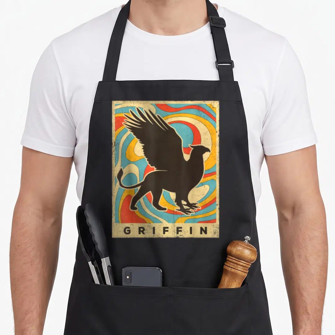 Funny griffin apron - Black griffin silhouette over colorful concentric swirls with GRIFFIN text below — shown on a black cotton canvas apron against a white background