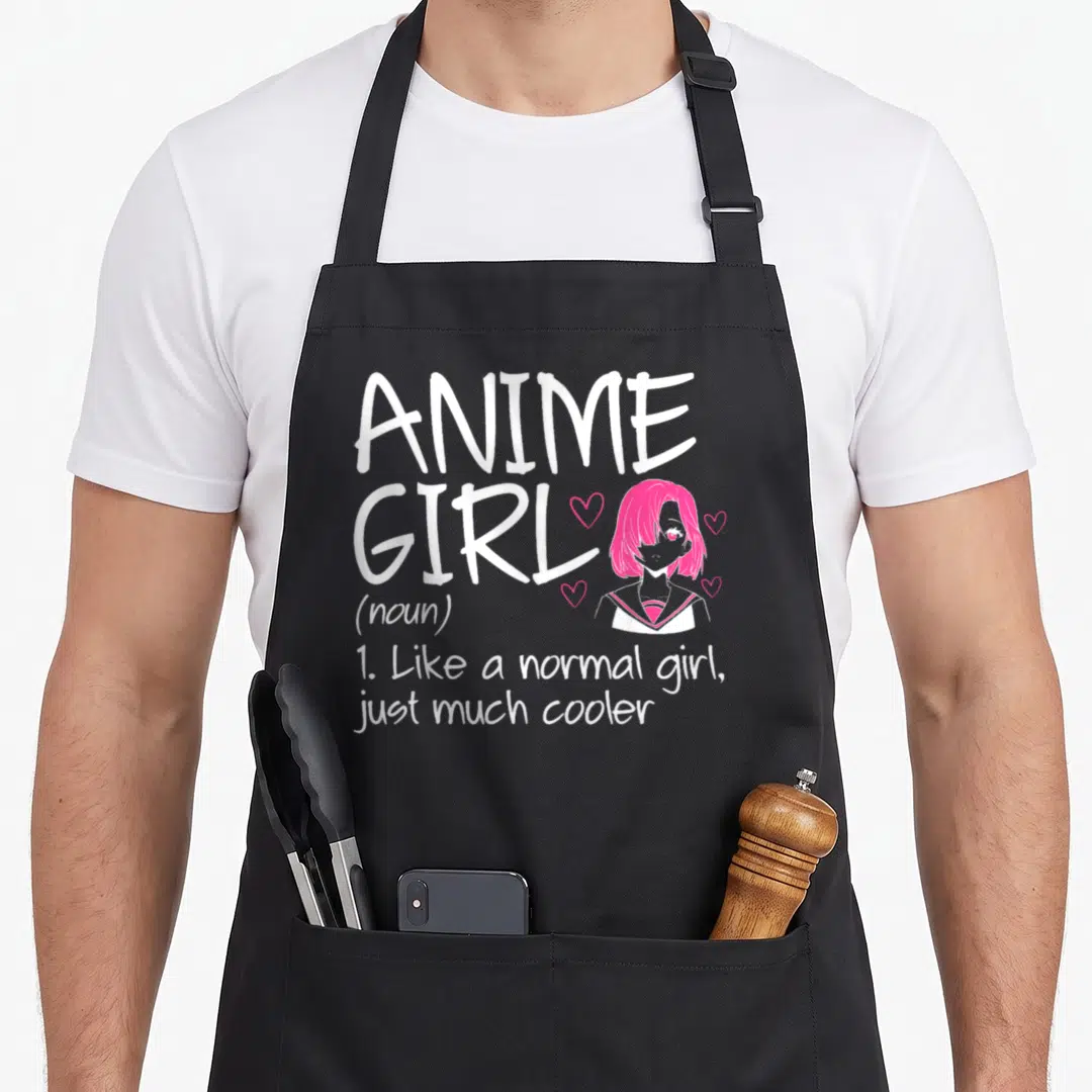 Definition anime apron - White text reading ANIME GIRL next to a pink-haired cartoon girl surrounded by hearts — shown on a black cotton canvas apron against a white background