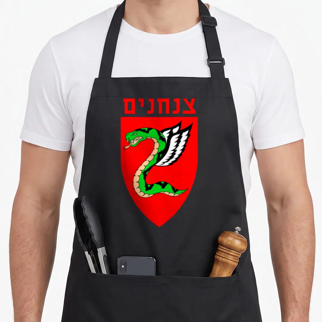 Tzanchanim israeli apron - Red shield with green winged snake and Hebrew text — shown on a black cotton canvas apron against a white background