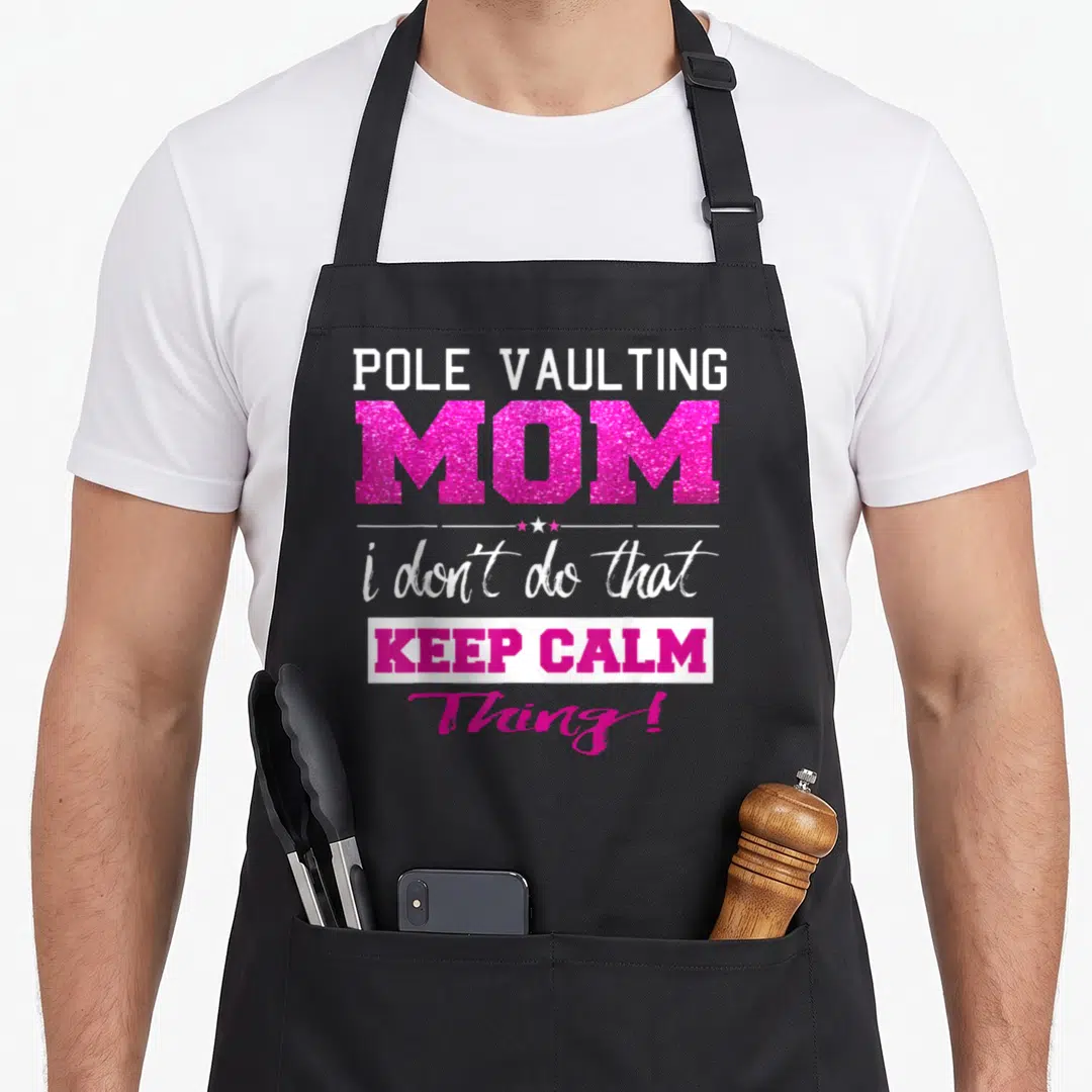 Pole mother's apron - Stacked pink and white text reading POLE VAULTING MOM i don't do that KEEP CALM Thing! with three — shown on a black cotton canvas apron against a white background