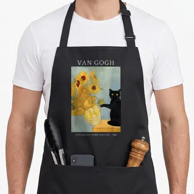 Meme van gogh apron - Black cat touching yellow sunflowers in framed art with text labels — shown on a black cotton canvas apron against a white background