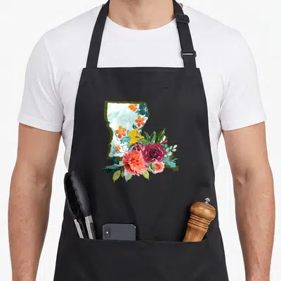 Watercolor louisiana apron - Louisiana state map silhouette filled with light blue texture and watercolor flowers — shown on a black cotton canvas apron against a white background