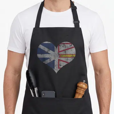 Newfoundland labrador apron - Distressed heart shape filled with blue white red and yellow flag pattern — shown on a black cotton canvas apron against a white background